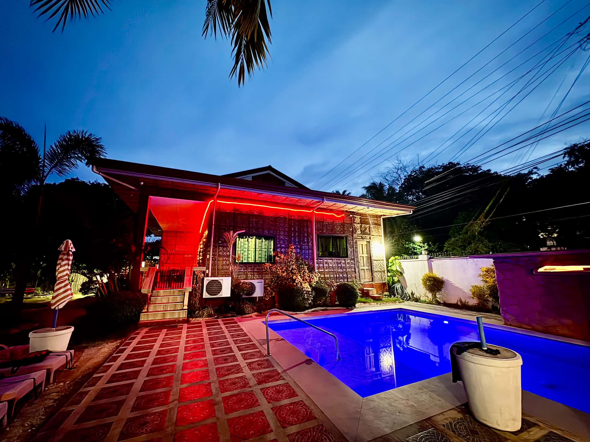 Pool Glowing Blue at Night at Balay Amakan